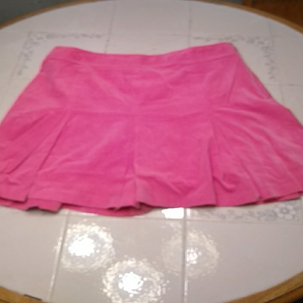 Pink size 14 tight cord skirt.     196